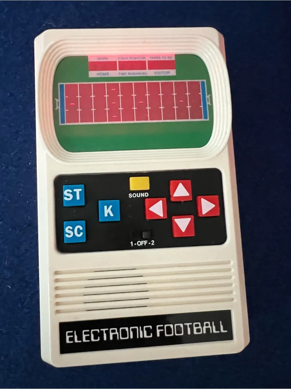Mattel Electronic Football Handheld Game in White with Red and Blue Buttons